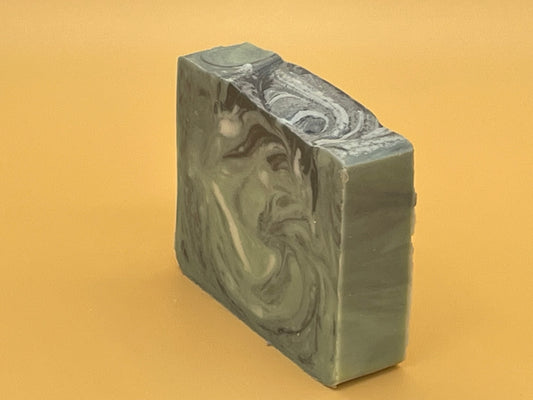 Handmade Balsam Fir tallow soap bar with forest-inspired green and black design, rustic and natural style.
