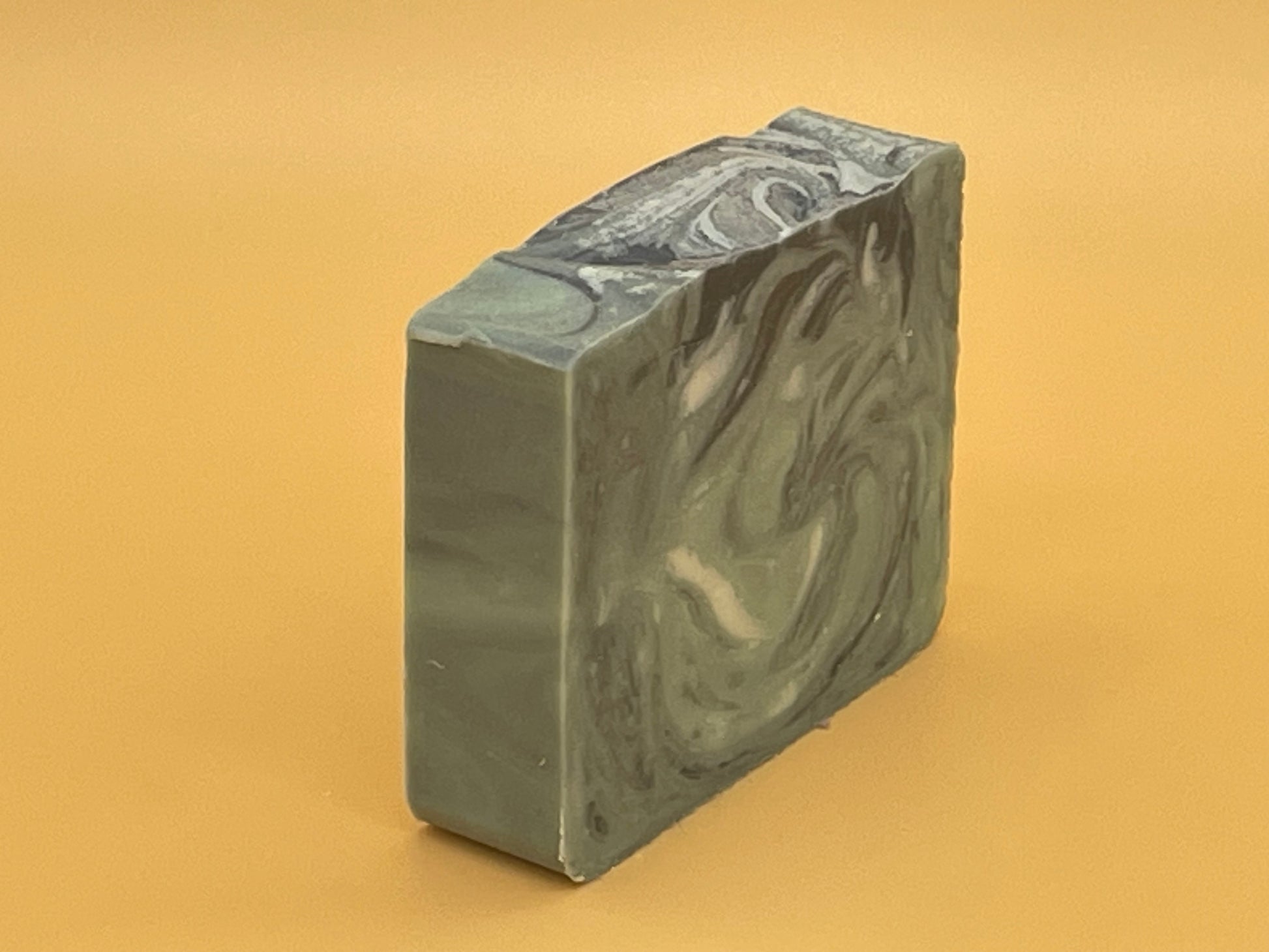 Balsam Fir Bar Soap — handcrafted tallow soap with balsam and fir fragrance, green and black marbled design.