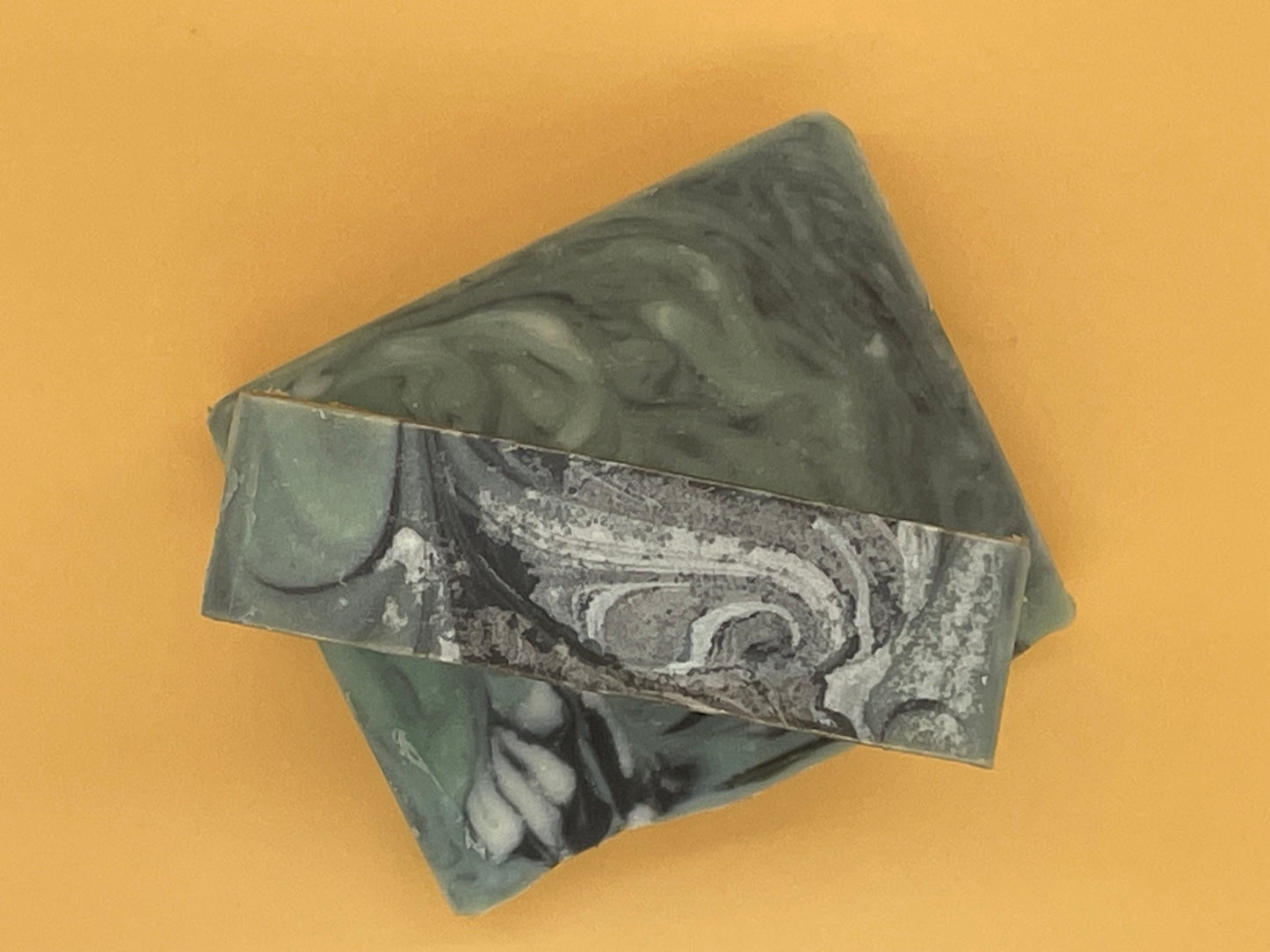 Close-up of Balsam Fir Bar Soap with green and black pattern, rustic handmade tallow soap by Talley’s Soap Co.