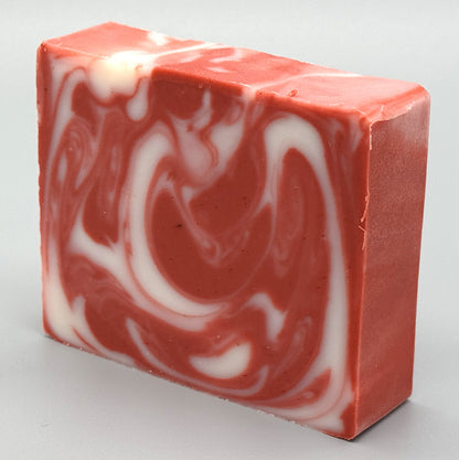 Handmade Candy Cane Bar Soap - tallow-based Christmas soap with red and white swirls-left view