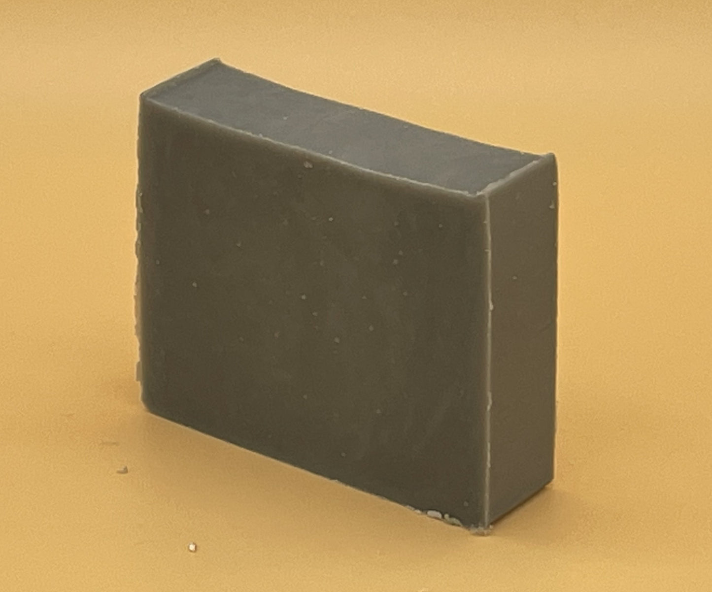 Sandalwood Bergamot Bar Soap at an angle by Talley’s Soap Co — handmade tallow soap with Steel Works gray color, rustic and natural style.