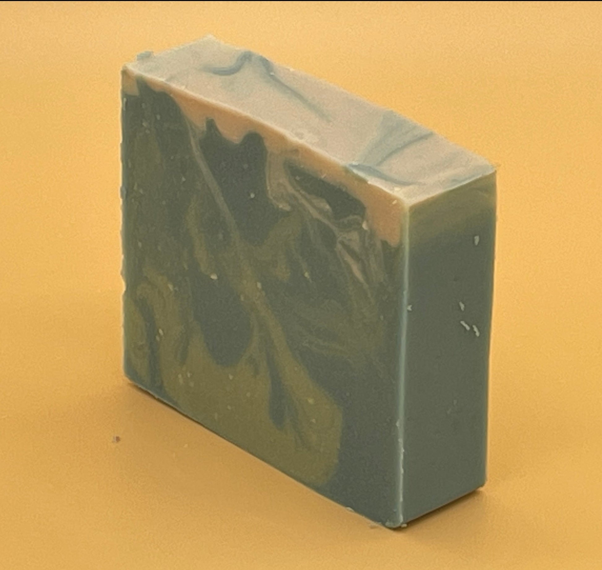 Side angle of The Seafarer handmade tallow soap with ocean-inspired swirl design