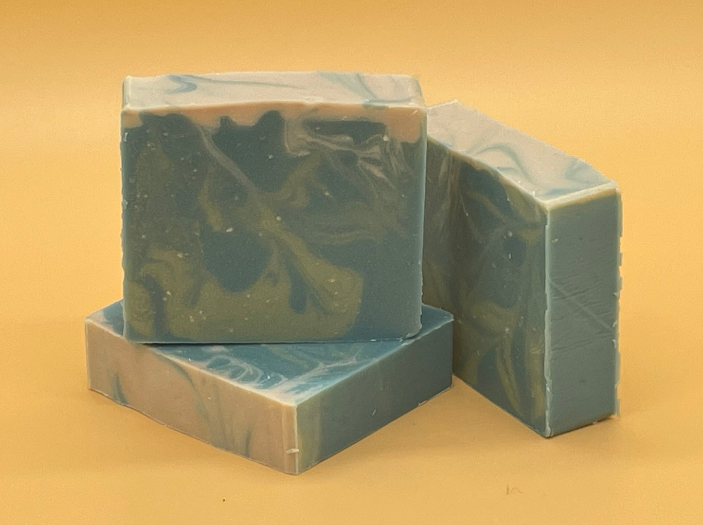 Set of three Seafarer handmade tallow soap bars with blue and cream ocean swirl pattern